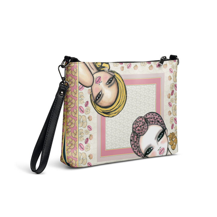 Angled view of the Le Jardin des Muses crossbody bag with wrist strap